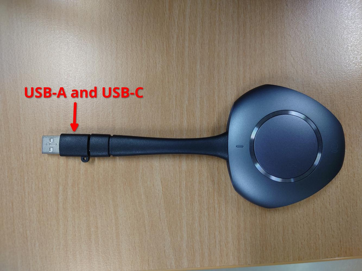 Shows the USB-A/C dongle for wirelessly connecting a computer
